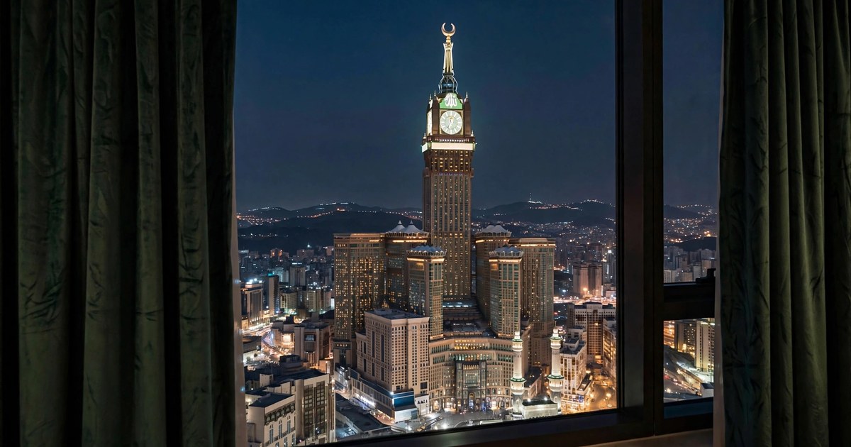 The Makkah clock tower seen at night from a hotel room window near Masjid al-Haram