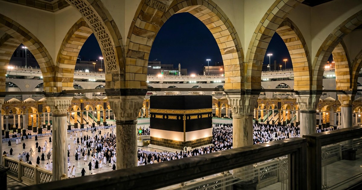 The upper floor of Masjid al-Haram at night, overlooking the mataf and the Kaaba