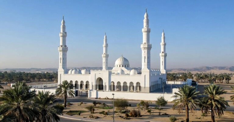 Masjid Dhul Hulaifah, the miqat mosque near Madinah, with its white minarets and date palms