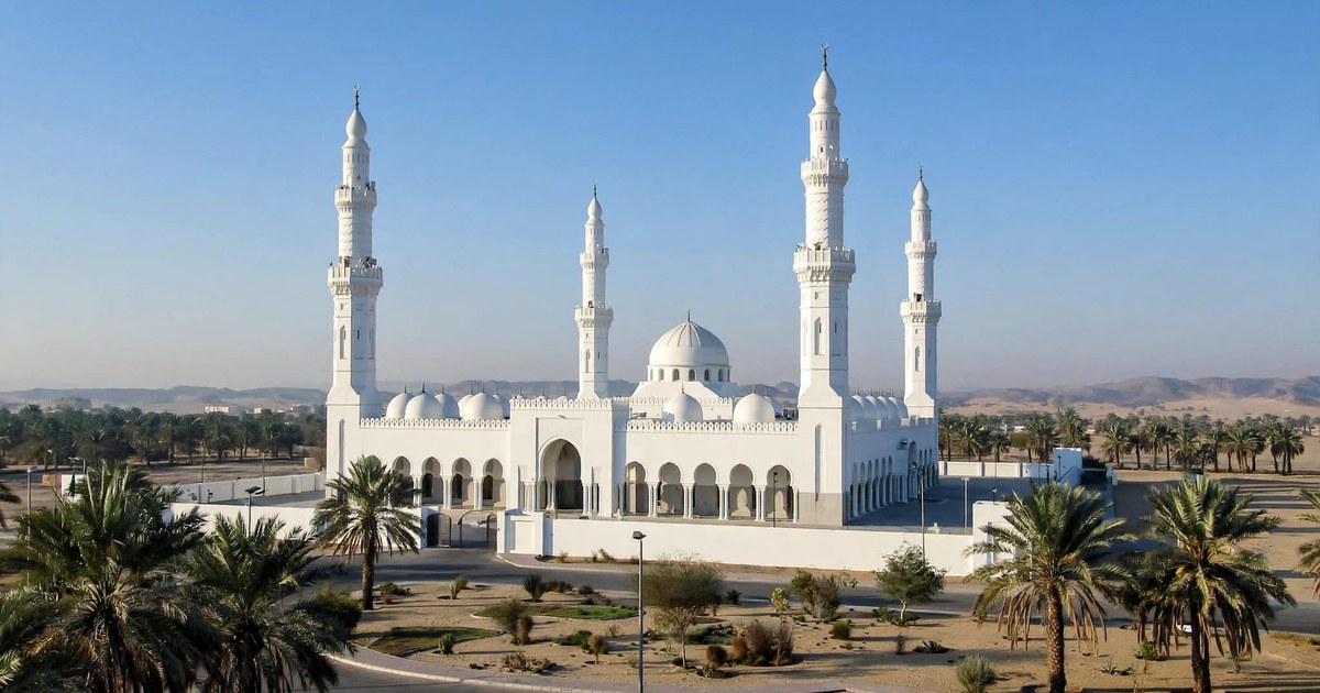 Masjid Dhul Hulaifah, the miqat mosque near Madinah, with its white minarets and date palms
